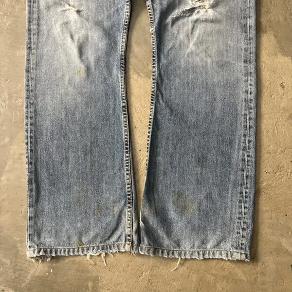 Levi’s 512 Bootcut 2000s Distressed Thrashed Light Wash Raw Hem Jeans